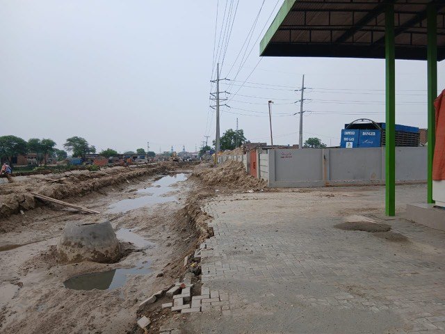 Road and drainage works alongside the plant boundary at Gujjar Colony